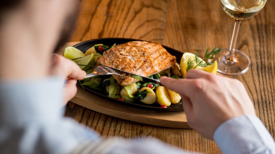Man eating salmon